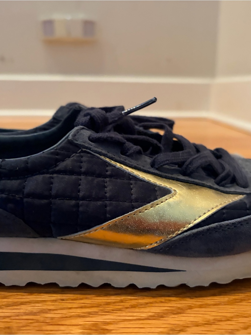 Brooks Women's Black Quilted Sneaker with Metallic Gold Logo